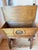 A statement French Provincial dough bin console, known in France as a pétrin or maie, dressed in warm walnut veneer and...