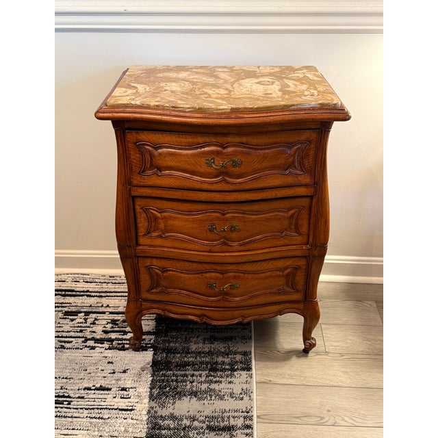 This exquisite Mid-Century French Provincial style commode/nightstand was crafted by the prestigious Danby Furniture...