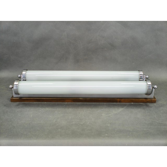 Elegant large Art Deco wall light produced in Czechoslovakia during the 1930s. This refined modernist fixture combines...