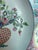 A large 16” diam Chinese 18th century famille rose export porcelain charger, decorated with flowers in a basket.