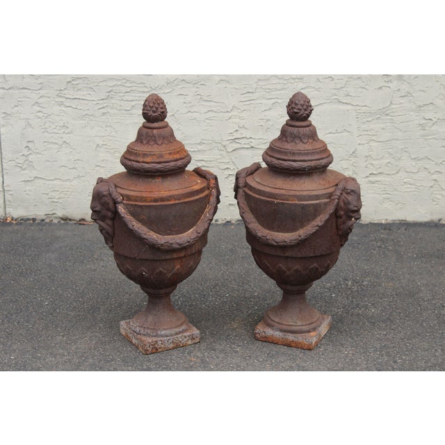 High Quality Vintage Pair of Lidded Urns with Figural Masks and Laurel Swag