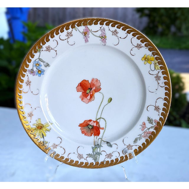Four (4) antique hand‑painted porcelain plates by Fischer & Mieg / Pirkenhammer, from the late 19th–early 20th century....