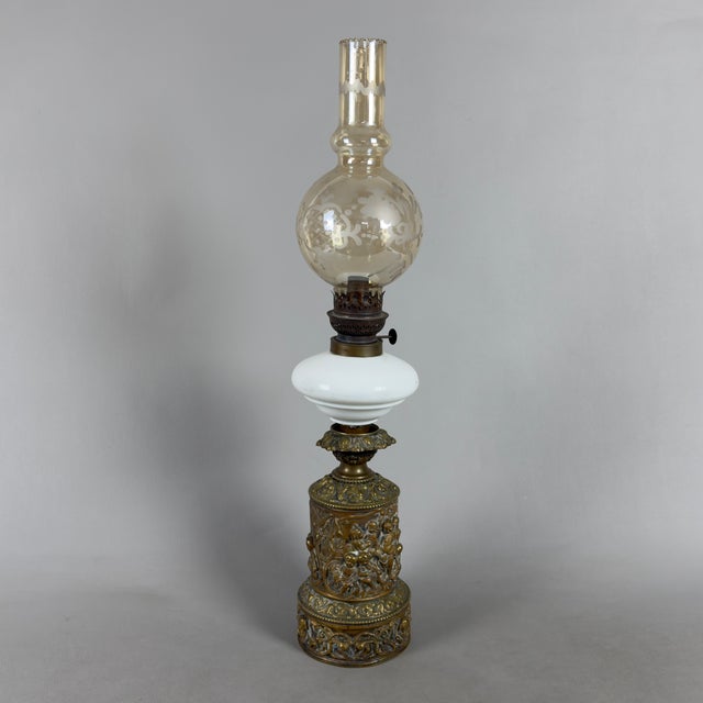 This imposing oil lamp is a piece of rare elegance and collectible value, a testament to refined 20th-century french...