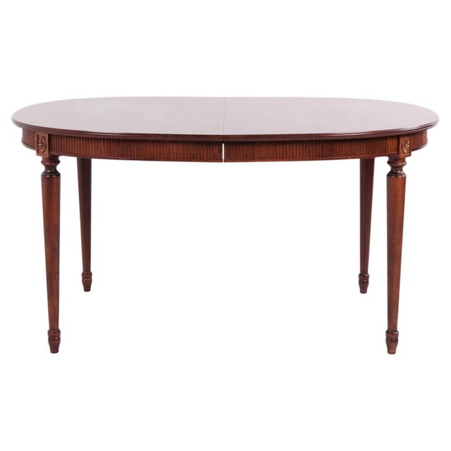 Oval dining table from the 1940s, made of mahogany in Gustavian style. The table comes with three extension leaves, each...