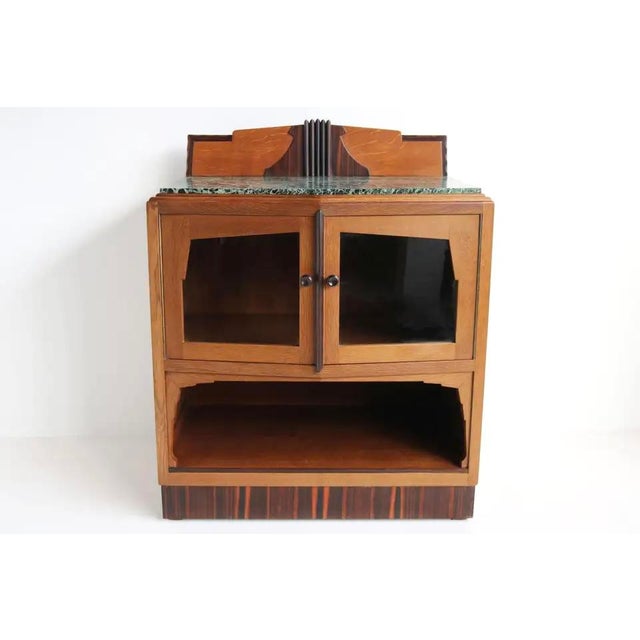 Gorgeous Dutch antique Amsterdam School style tea cabinet. Striking Dutch Art Deco design from the 1920s. The blonde oak...