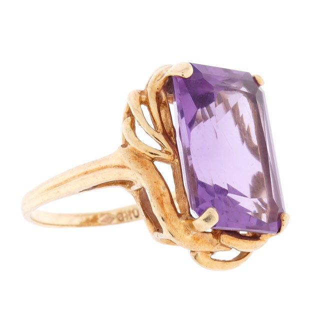 10K Yellow Gold and Amethyst Cocktail Ring. Prong set rectangular faceted Amethyst stone, approximately 17mm x 5mm. Ring...