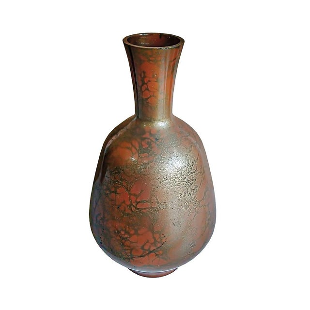 An elegant brass vase, hand-crafted in Japan, Showa Period. The finish is Murashido, a centuries-old technique that...