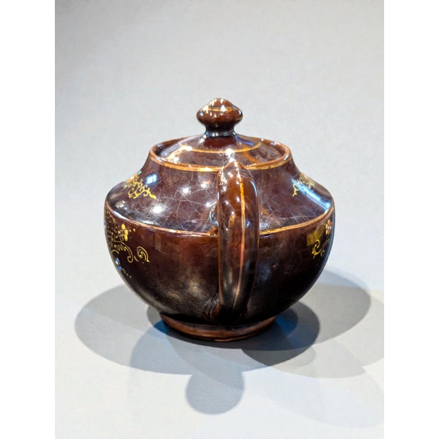 This Vintage Japanese Moriage Hand-Painted Redware Teapot is a stunning example of traditional Japanese ceramic artistry....
