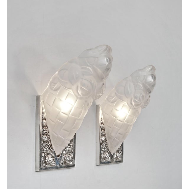 Degué wall sconces A nice pair of 1925-1930 French art deco wall sconces in nickel plated solid brass or bronze. It holds...