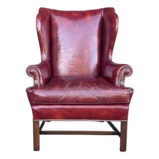 Vintage Burgundy Leather Wingback Chair With Brass Nailhead Trim by Baker For Sale