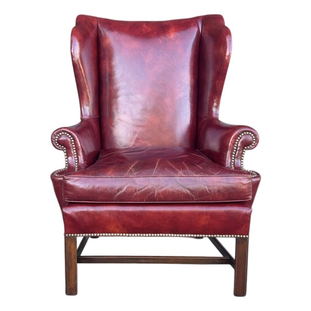 Vintage Burgundy Leather Wingback Chair With Brass Nailhead Trim by Baker For Sale