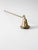 Vintage brass candle snuffer with a long twisted handle and engraved bell-shaped snuffer, finished with a delicate...