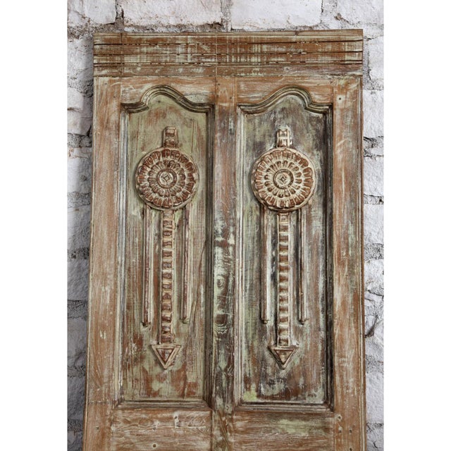 This vintage carved barn door has been beautifully restored keeping its original carved details patinas that make a...