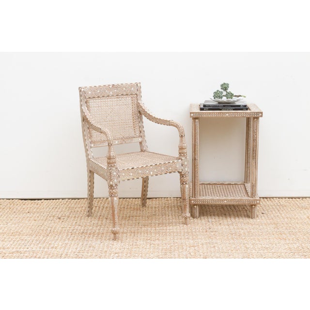 Add a touch of refined history and individual elegance to your space with this beautifully inlaid armchair. Featuring a...