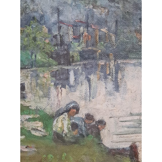 Early 20th century Impressionist oil on canvas of washerwomen by a river by Stanley. The painting is signed and dated...