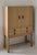Light oak bar cabinet by Kurt Ostervig, 1960. This Danish wooden cabinet produced by K.P Mobler has two (2) doors that...