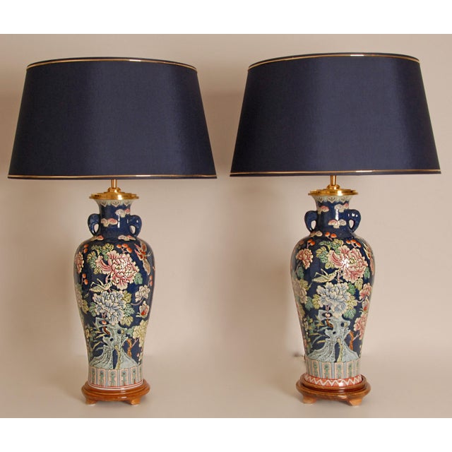 Vintage Chinese Ceramic Oriental Porcelain Table Lamps. Decor Famille Rose on a blue fond with gold trimmed blue lampshade...