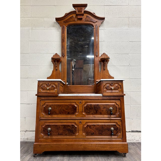 This is a rare and absolutely stunning antique large walnut American Renaissance Victorian Eastlake marble top hand carved...