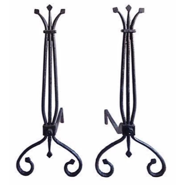 Pair of vintage wrought iron andirons. Early American design.