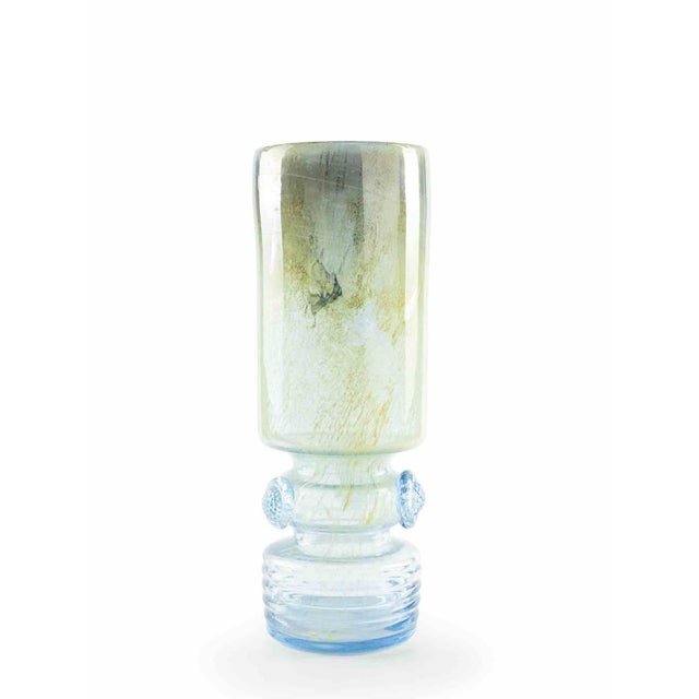 This blue glass vase realized in the 1970s by a european manufacture. Very good conditions. This very precious decorative...