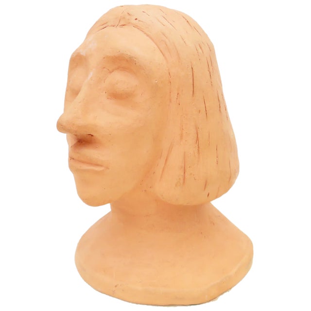 intriguing unglazed terracotta bust; eyes closed, classical European features, chin length hair. A wonderful art piece for...
