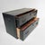 This antique Japanese chest has a strong, understated silhouette with two spacious drawers and a deep dark-lacquered...