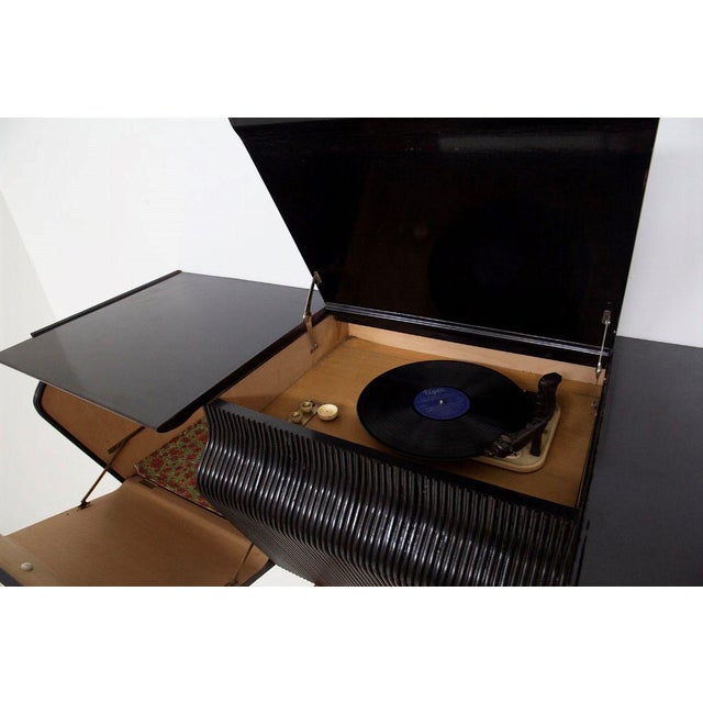 Suspended Sideboard attributed to Osvaldo Borsani, in Good conditions. Designed 1950 to 1959 This piece is attributed to...