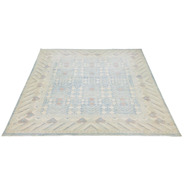 This hand-knotted wool rug reinterprets traditional East Turkestani motifs for modern living. Featuring the iconic...