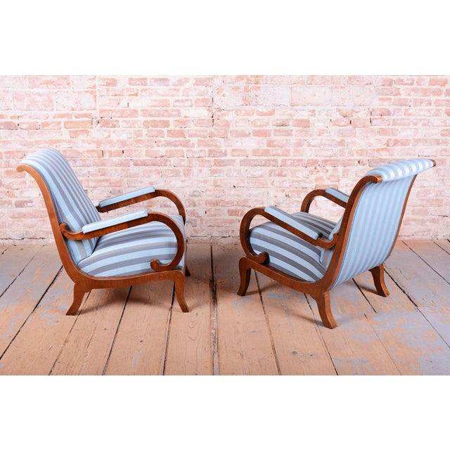 This pair of armchairs is a truly magnificent and refined showcase of high-end bourgeois furniture from the early...