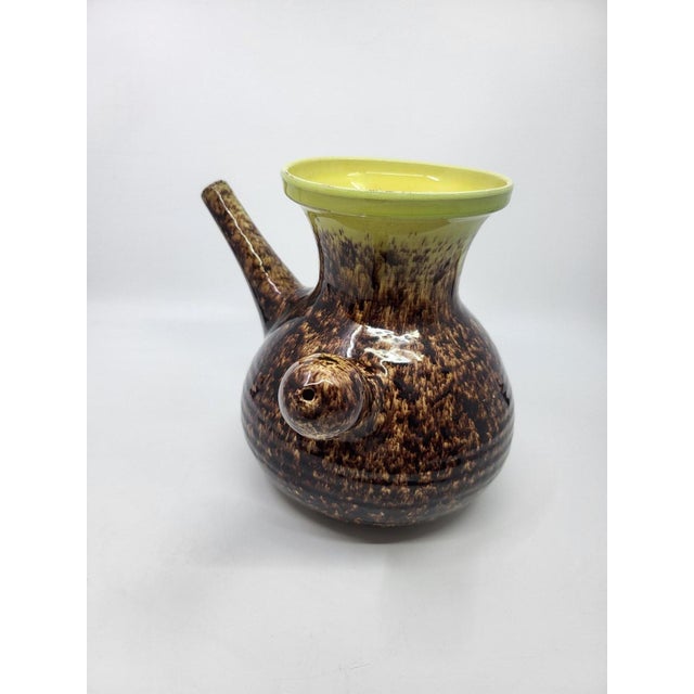 A pitcher that can also be used as a vase. with extraordinary colors, achieved through an innovative process that blends...