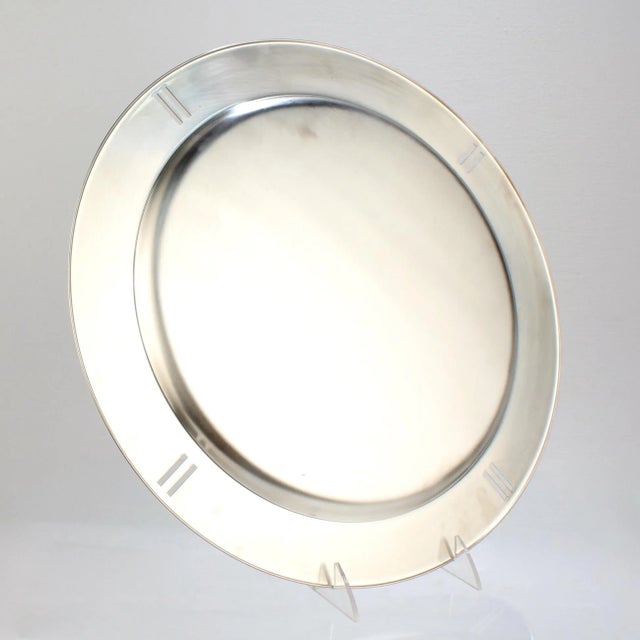 A fine large silver plated charger or tray. Designed by Richard Meier for Swid Powell. Model no. 417. Together with its...