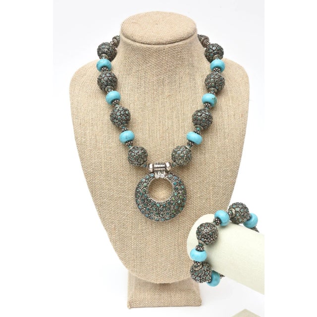 This is part of Chairish’s Costume Jewelry assortment. This fabulous and bold set is made of turquoise and silver metal....