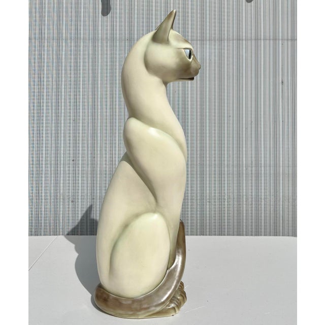 Large retro Siamese cat sculpture, hollow ceramic and hand painted. Add a touch of vintage aesthetic with this unique...