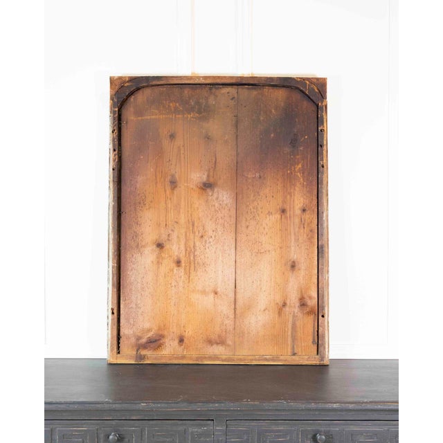 Built with a wood panel frame, this eighteenth-century French mirror in the Louis XVI taste shows carved detailing and a...