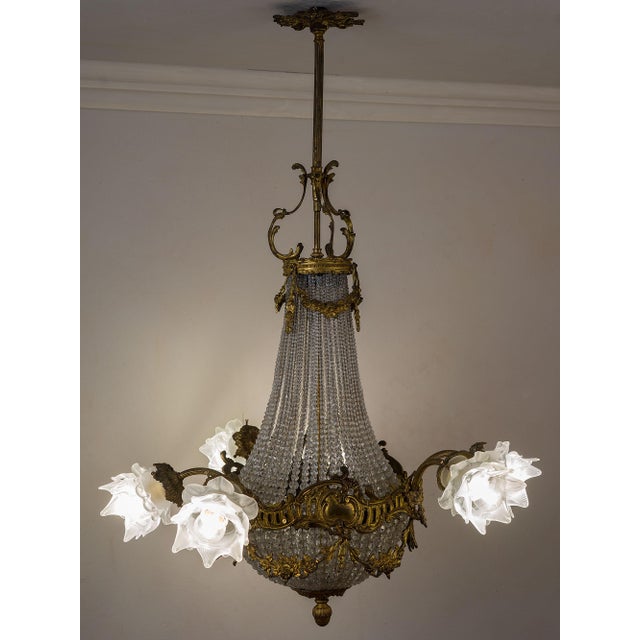 Antique hot air balloon chandelier from the Belle Époque, dating between 1890 and 1910. Made of chiseled gilt bronze and...