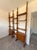 Immerse yourself in the timeless elegance of 1960s design with this magnificent modular teak bookcase. This unique piece,...