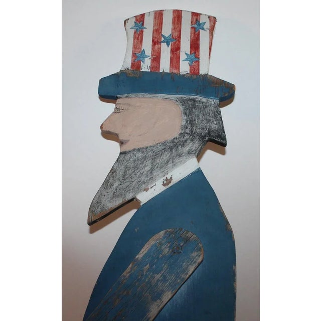 Handmade and painted Tall standing Uncle Sam in all original painted surface.. Think pieces of wood make up this wonderful...