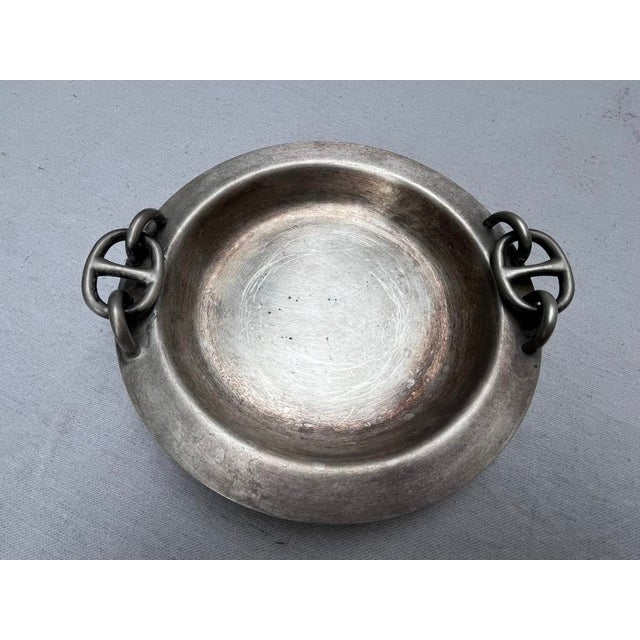 A single vintage round silver plated bowl or dish featuring chaine d'ancre handles. Interior base measures 6". Marked...