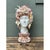 This vintage plaster bust presents a striking marriage of classical form and natural coastal artistry, its smooth,...