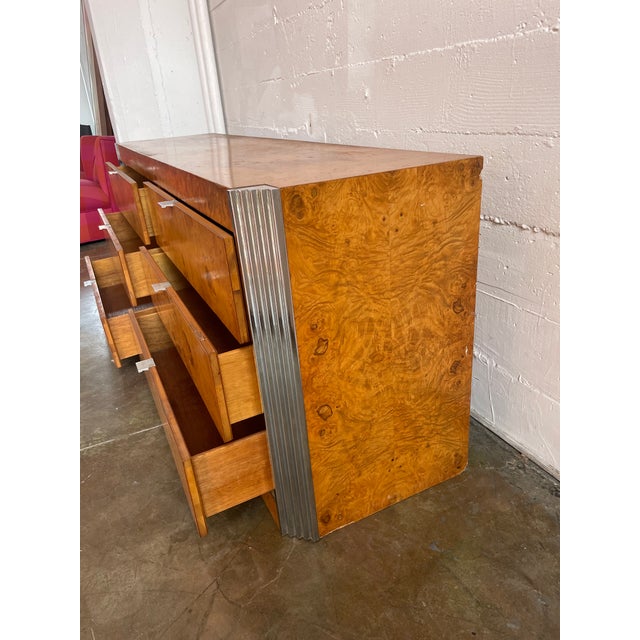 "Skyscraper" Burled Elm and Chrome 6-Drawer Dresser, in the style of Milo Baughman (unsigned), c. 1970s. Drawer interiors...