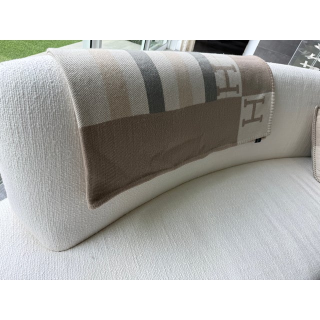 A genuine Hermès Avalon throw in the coveted 100% cashmere iteration — hand-spun and hand-woven by artisans in Nepal....