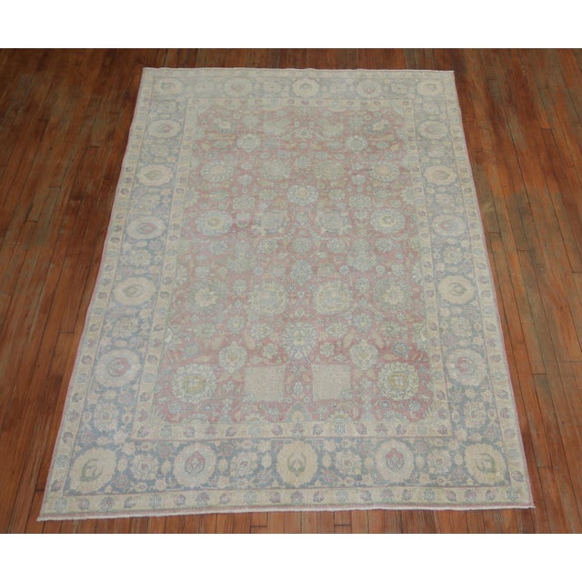 Classic all-over design Persian Tabriz rug with a blush raspberry pink ground and gray border, circa 1940. Measures: 5'9”...