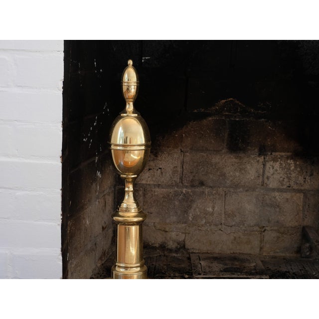 Federal style double lemon top brass andirons, in good condition.