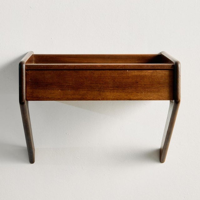 Teak floating nightstand with one drawer from the 1960s, designed by Sigfred Omann for Ølholm Møbelfabrik. The surface of...