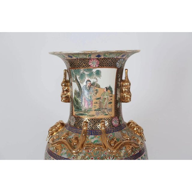 Hand-painted Chinese vase in giant size with plastic gilded decorations. Very fine and detailed painting. The vase is...