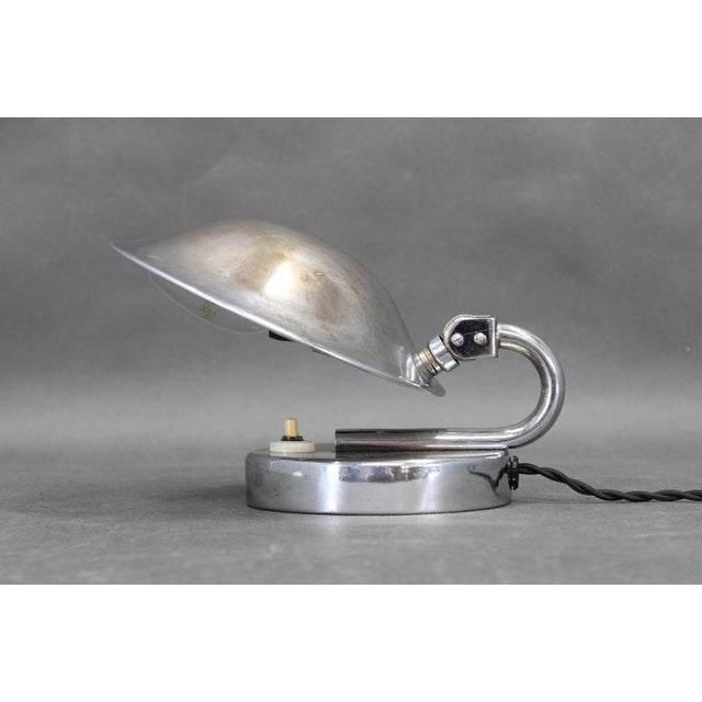 Exceptional Bauhaus adjustable table lamp produced in Czechoslovakia during the 1930s. Crafted from nickeled metal with an...