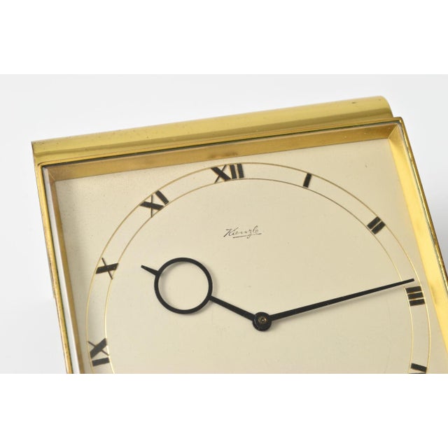 Beautifully crafted art deco desk clock from Kienzle. Made of solid brass and faceted glass. Clock uses 6 jewel, 8 days,...