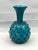Mid-Century Modern Italian art glass vase from the Empoli region, featuring a vivid teal-blue cased glass body with raised...