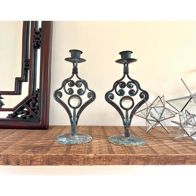 Pair of vintage taper candle holders -- made of metal with a glass medallion sphere in the center of each. Purchased used,...
