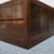 An Art Deco coffee table by Betty Joel. Australian walnut veneered with burr walnut banding. Extensive integral storage...